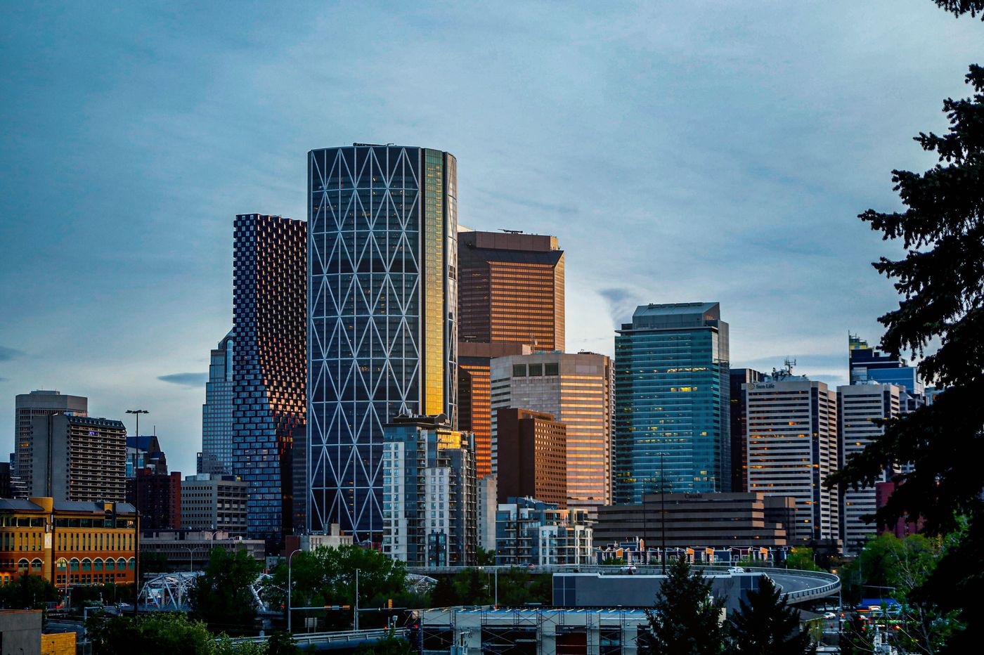 Calgary's downtown skyline in daylight, seen from across the river valley