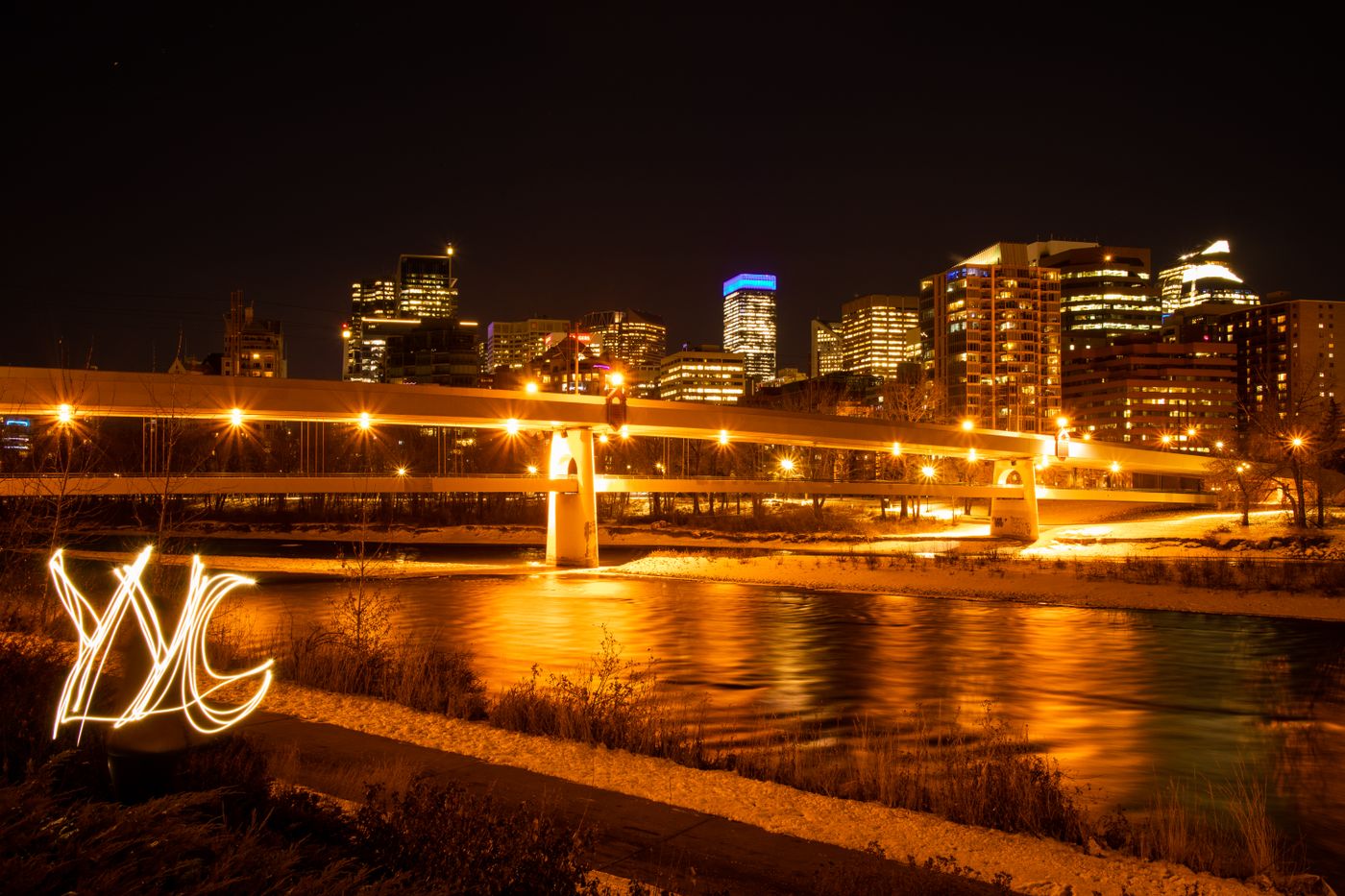 Calgary's Centre Street Bridge and downtown skyline lit up at night